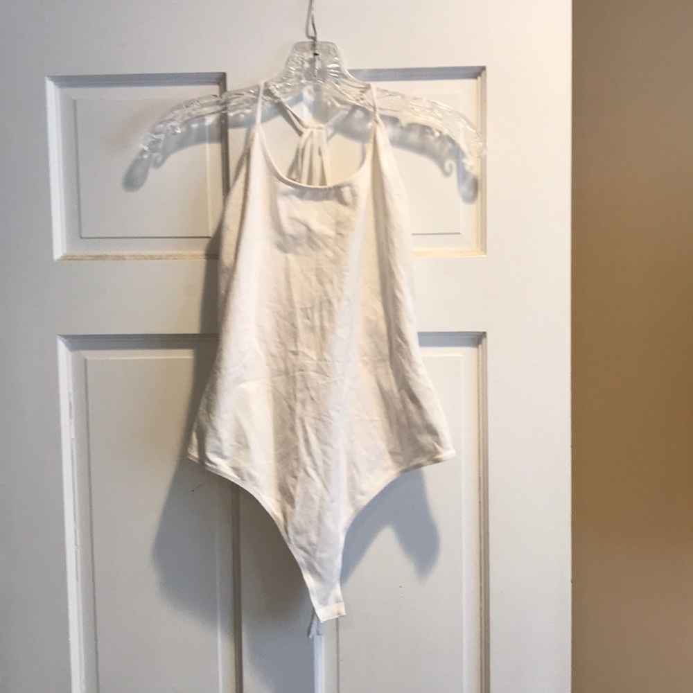 White bodysuit with an open back